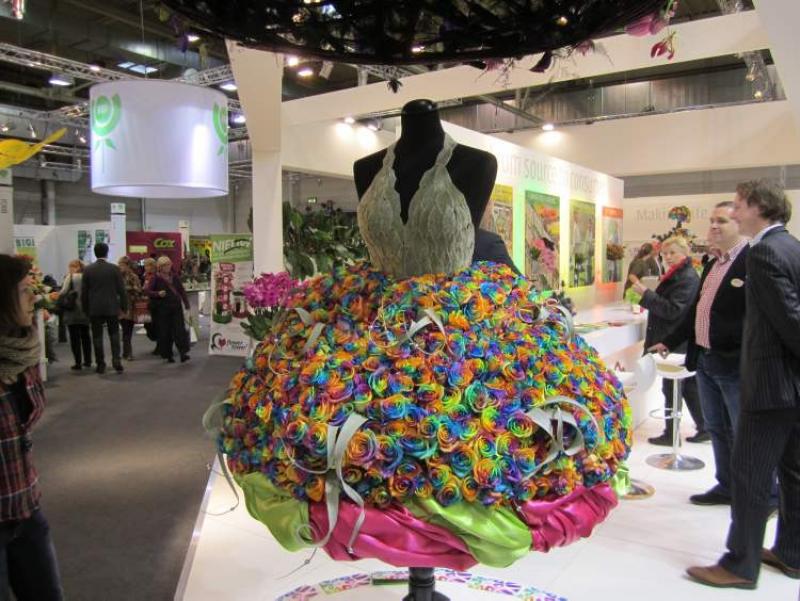 This year's furniture show in Essen, Germany, featured lavish displays. Shown here is a dress of brightly coloured roses. Note the fitted bodice created from velvety-soft lamb's ears.