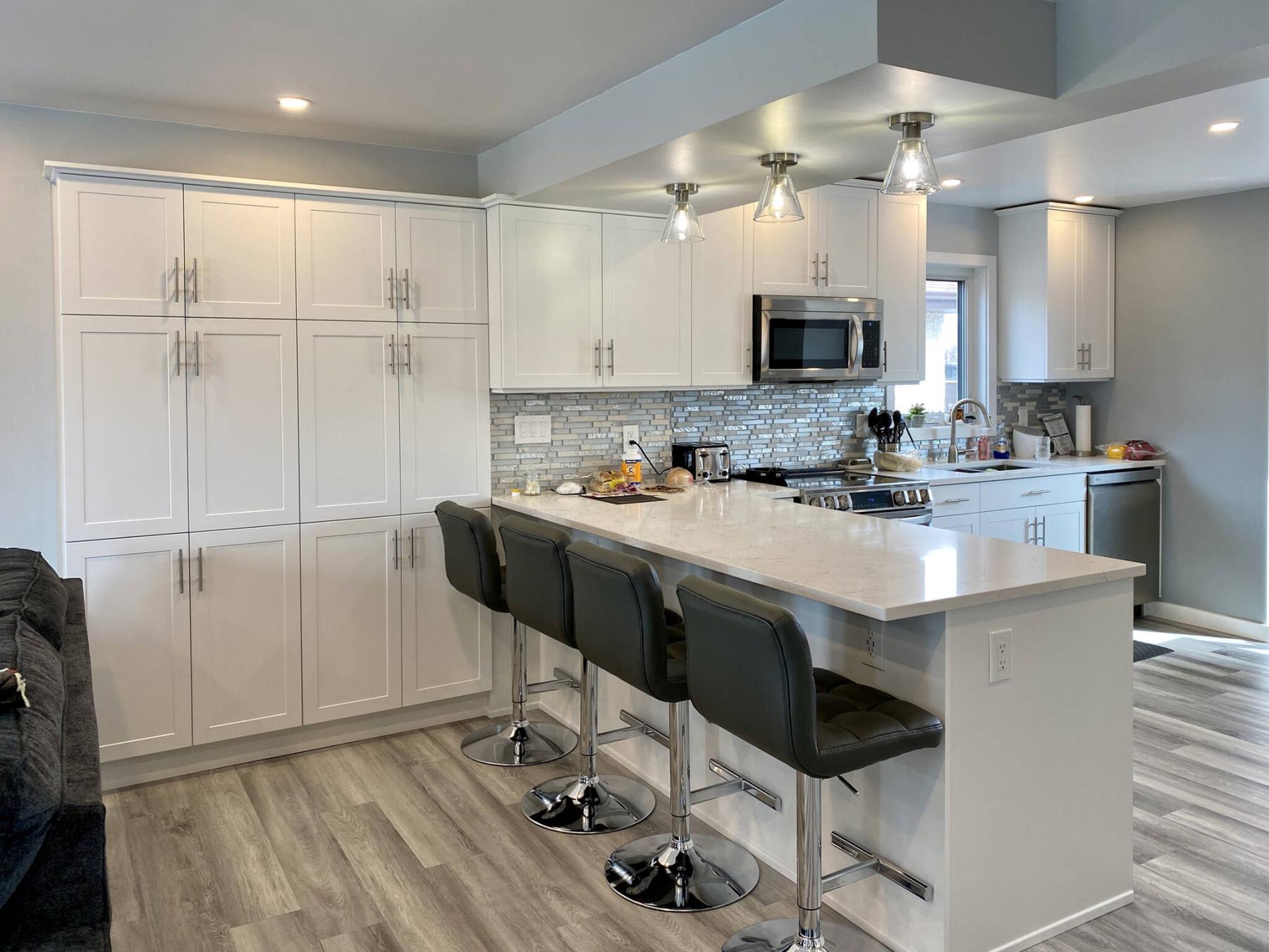  <p>Photos by Marc LaBossiere / Winnipeg Free Press</p>
                                <p>The design layout of the kitchen with new support beam and bulkhead, accommodates a full wall of cabinets on either side of the peninsula island.</p> 