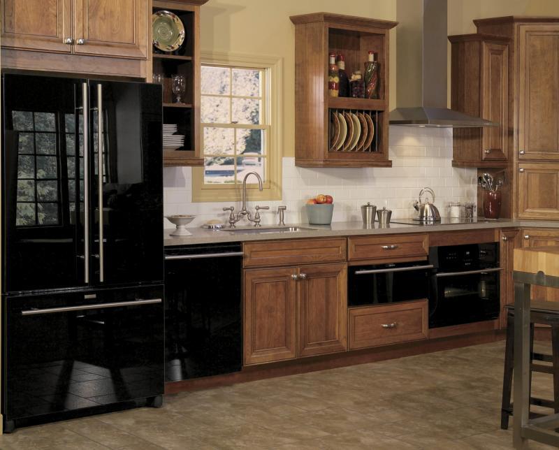 This kitchen is in a contemporary theme -- a palette of brown and black with whimsical touches of red.  Canadian design expert William MacDonald says when it comes to kitchen appliances, you get what you pay for. Good appliances are going to last 10 to 20 years. 