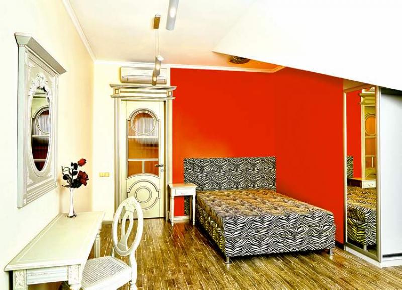 This bedroom shows how two very different decor styles can be successfully merged.