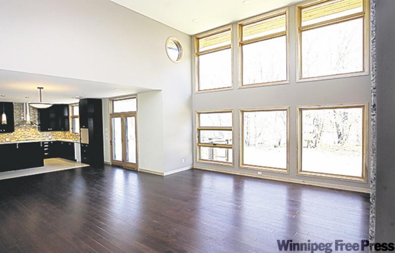 Huge windows in the great room maximize the river view, and let in a river of light too.