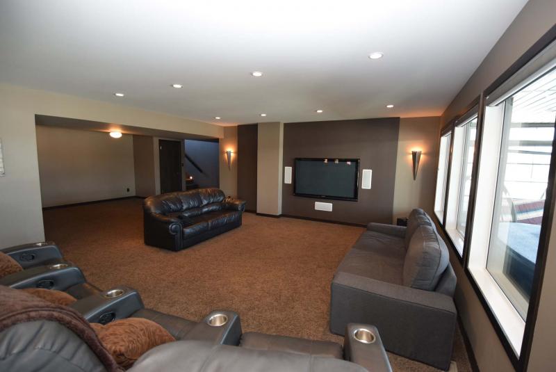 <p>The entertainment room is ready for family movies and football games.</p>
