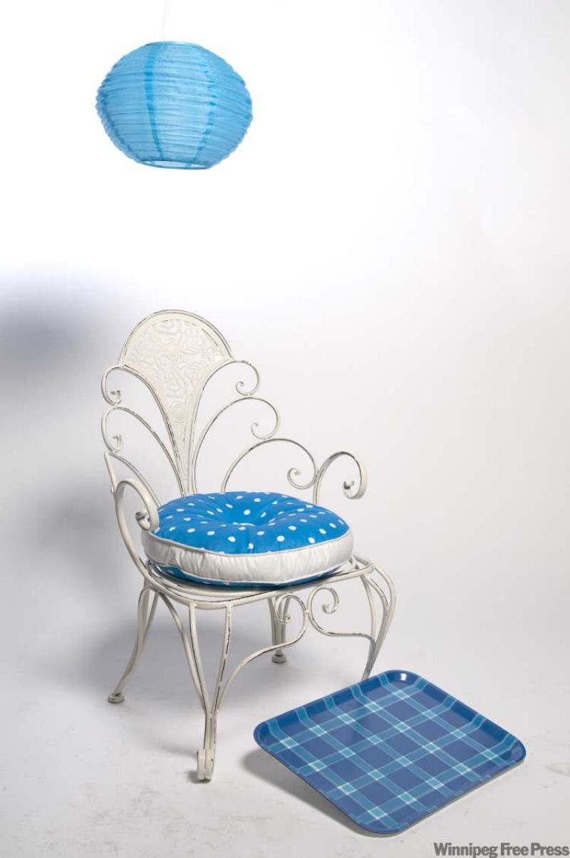 HomeSense white chair. Ikea polka-dot cushion, plaid tray and solar powered globe light.
