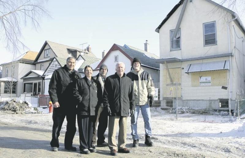 From left: Harvey Newman, Cheryl Lisoway and Marty Donkervoort with Inner City Development; Peter Squire with Housing Opportunity Partnership; and Don Miedema with Spence Neighborhood Association. The
