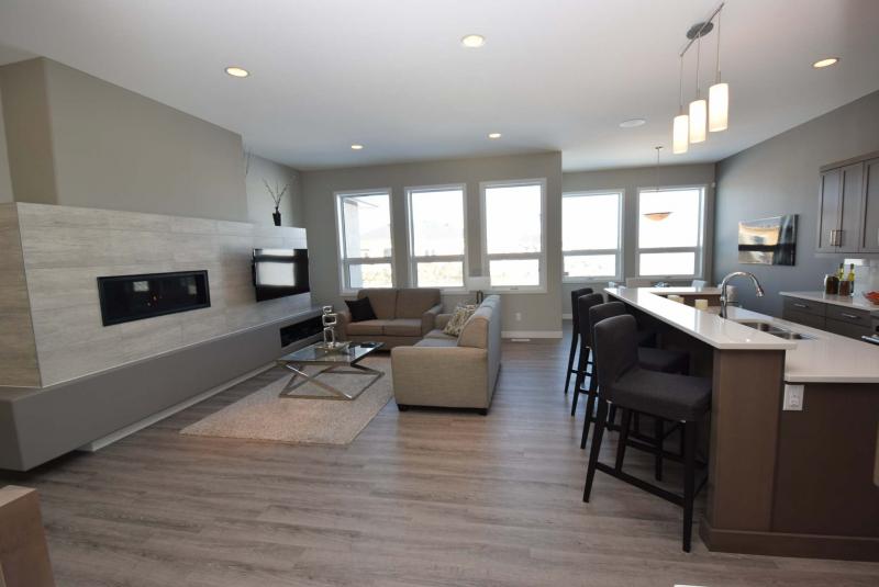 <p>Photos by Todd Lewys / Winnipeg Free Press</p><p>The open-concept great room of 12 Prairie Grass Lane benefits from a rear wall that is almost entirely comprised of large windows that allow an abundance of light into the space.</p>