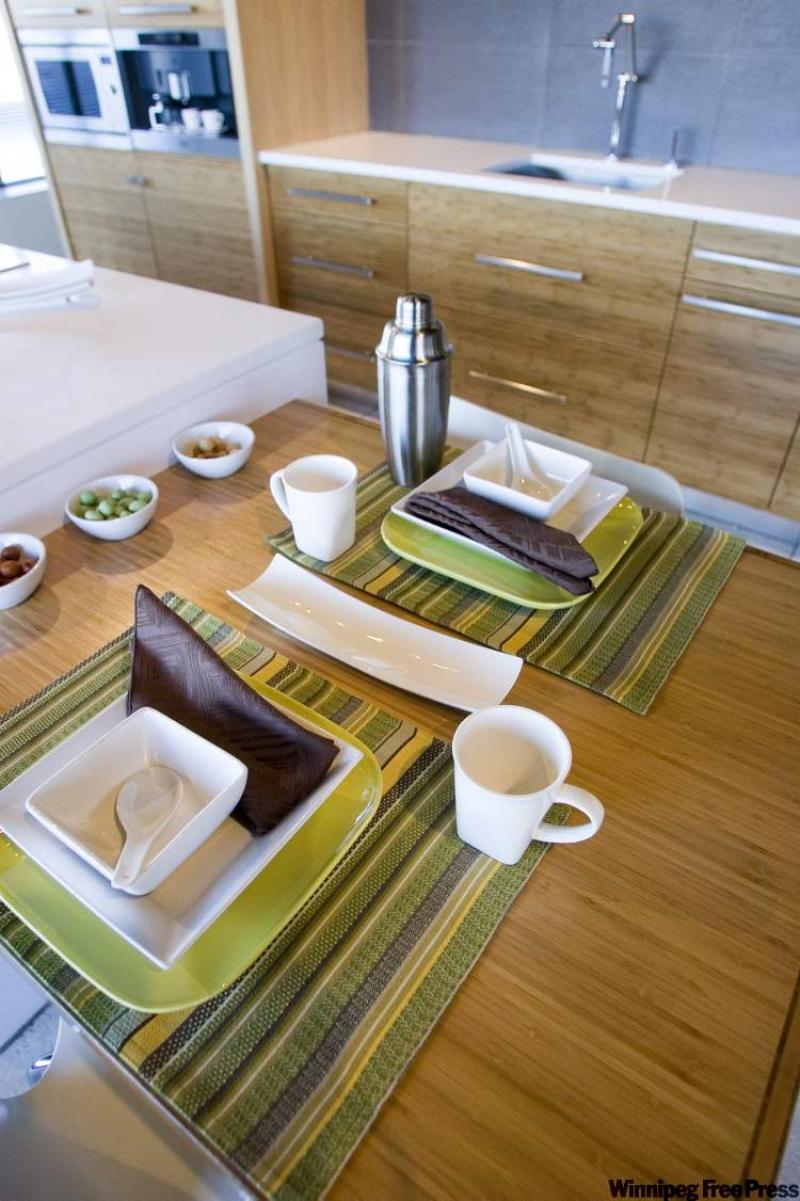 Aa bamboo table and cabinets with white Zeus Silestone, which is engineered from crushed stone particles.  