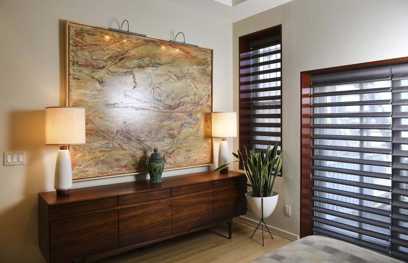 <p>Deep, dark trim in the bedroom is similar to that in the front of the home.</p>
