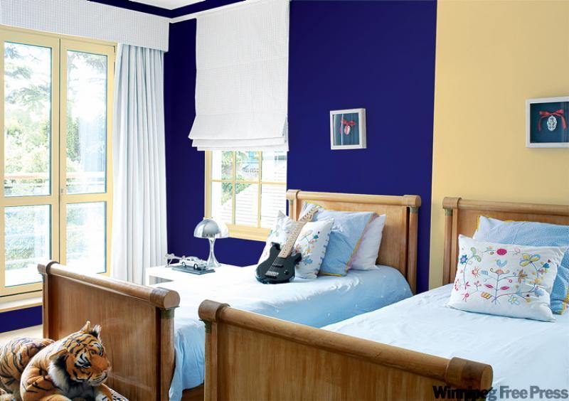 Dividing up a shared room with colour can help counter feelings that one child is getting more space than the other.
