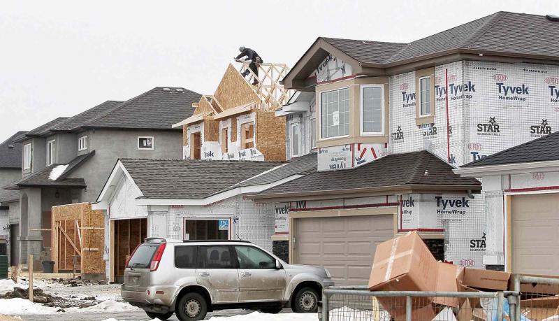 Above and below, construction continues in the new Waterford Green community, a new housing development located off Keewatin Street between Inkster Boulevard and Jefferson Avenue.