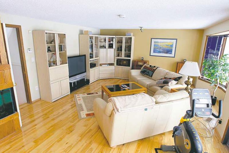 Family room with bay window and doors to deck.