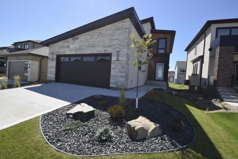 <p>The unique exterior of the Luxe in Bonavista invites you inside, where the home&rsquo;s interior is equally appealing, and functional as well. (Photos by Todd Lewys / Winnipeg Free Press) </p>