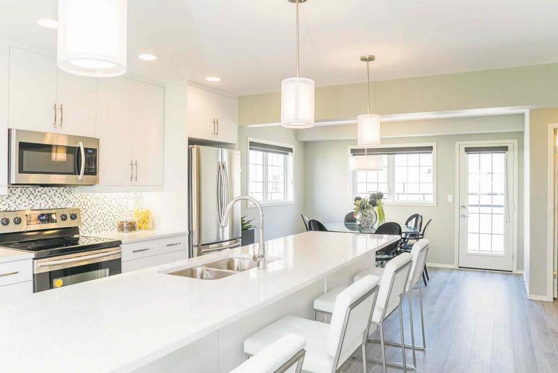 The Tamarackï¿½s island adds an elegant touch to the exceptionally functional kitchen.