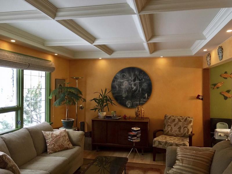 <p>Anthony Wlock</p><p>A decorative ceiling with coving, showcasing precision miters for crown moulding and underside trim, covers up the original stippled ceiling that was starting to crack.</p></p>