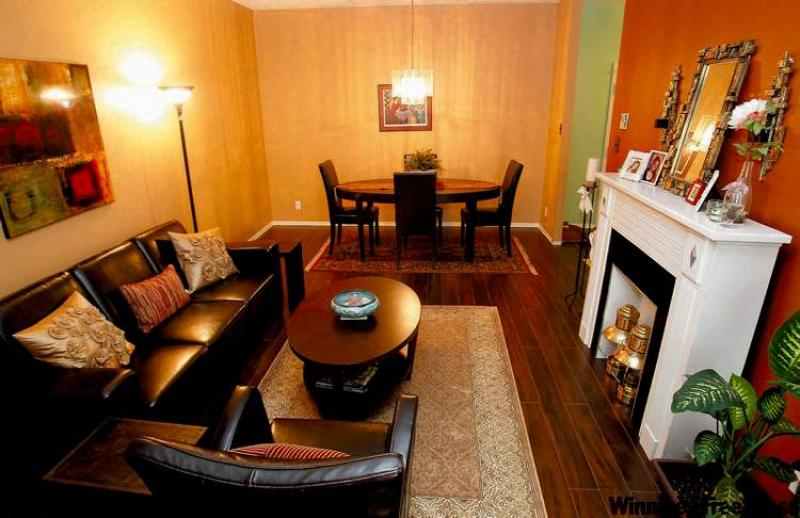 Sharon Hill (not her real name) hired a decorating consultant and had all of the painting and new flooring completed prior to moving in. Her new home abounds with rich colour and contemporary furniture, and reflects her personal style.