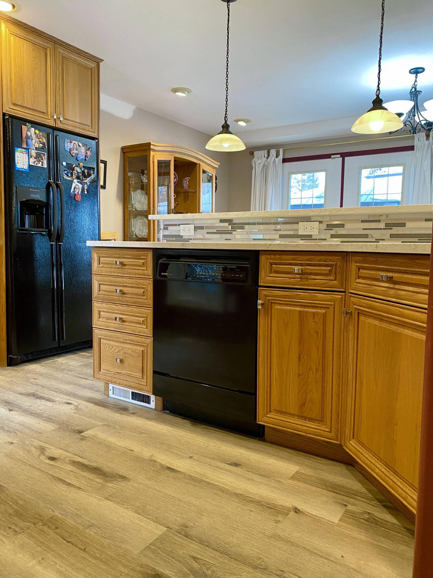 <p>Photos by Marc LaBossiere / Winnipeg Free Press</p><p>The existing cabinets take on a whole new look with new vinyl plank flooring below, and quartz countertops with mosaic backsplash above.</p>