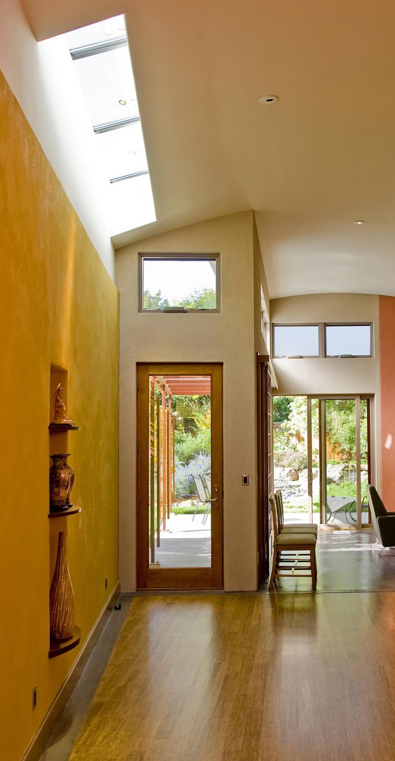 The main hallway features ceiling sky lighting that will catch the winter sun. The floors are constructed from bamboo. 