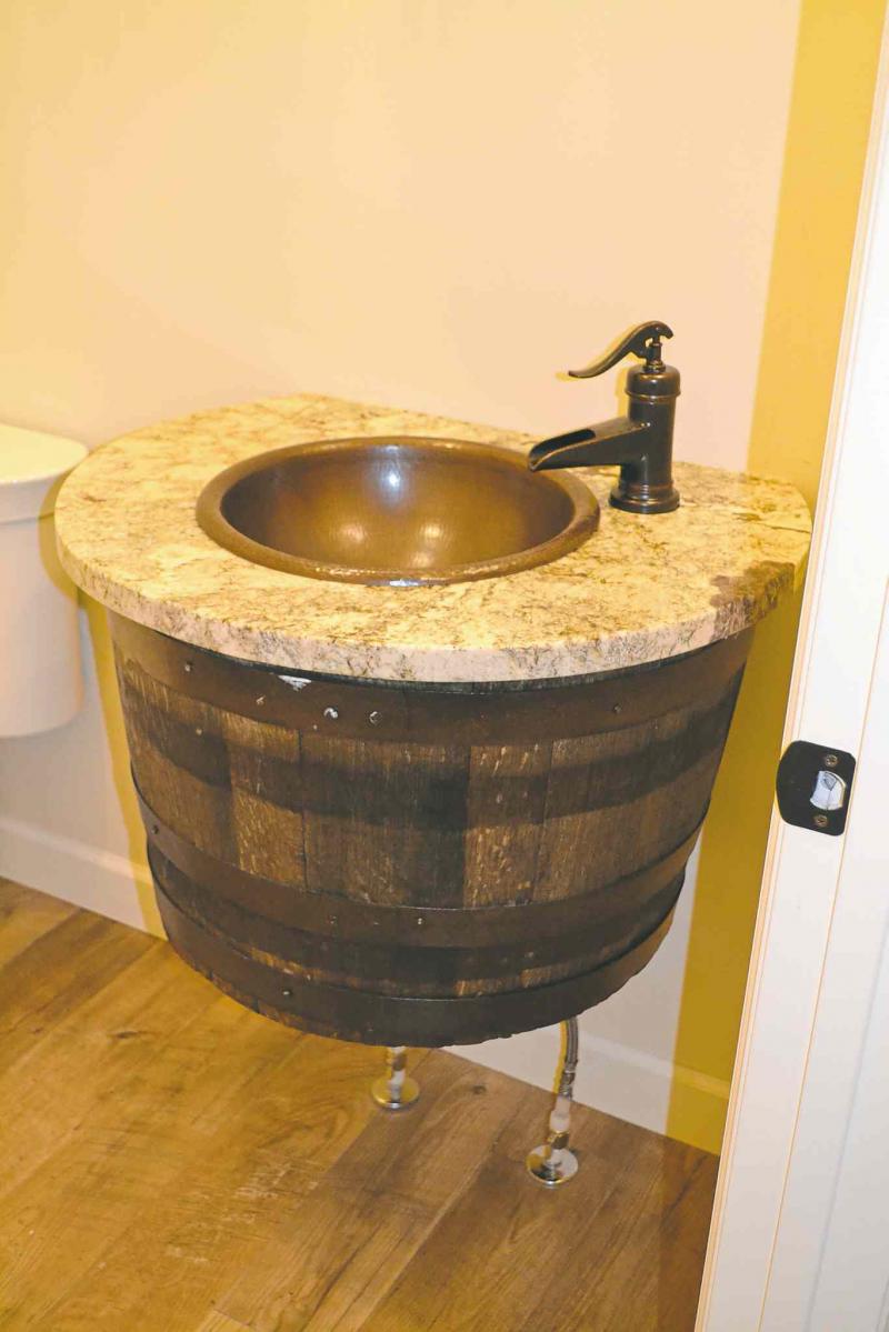 Vanity made from a whiskey barrel.