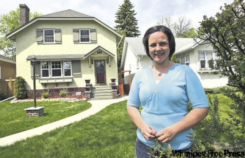 Michelle Bombay didn't buy her dream home in 2005, but with hard work and creativity, created one out of her former home at 359 Ash St.
