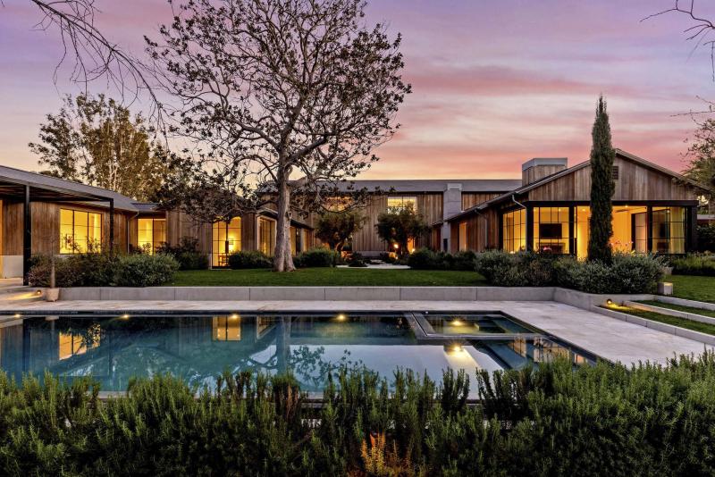 <p>The Grey Estate, the Holmby Hills home of late Paramount Pictures Chairman and Chief Executive Brad Grey, has sold for $68,822,500. Designed by Howard Backen, the modern farmhouse-style mansion sits behind wood- and steel-framed gates on 2.2 acres of grounds.(Simon Berlyn)</p>