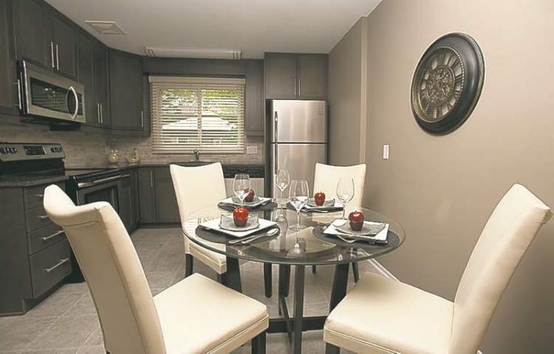 This freshly renovated townhouse condominium is not only affordable, it also offers all the amenities typically found in a brand-new home including cappuccino maple cabinets and black granite countertops in the kitchen.