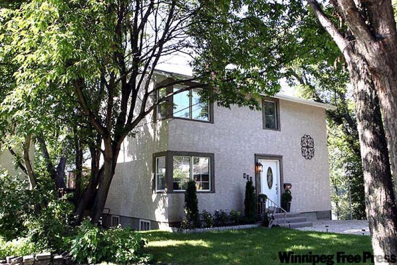 The exterior of 450 Bredin Dr. may be unassuming, but it hides a well decorated luxurious home with a grand view of the Red River. (Photos by Ruth Bonneville/Winnipeg Free Press)