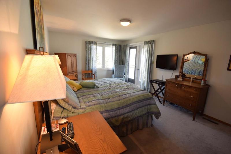 <p></p><p> Light floods into the spacious master suite courtesy of a south-facing window and west-facing patio doors.</p>