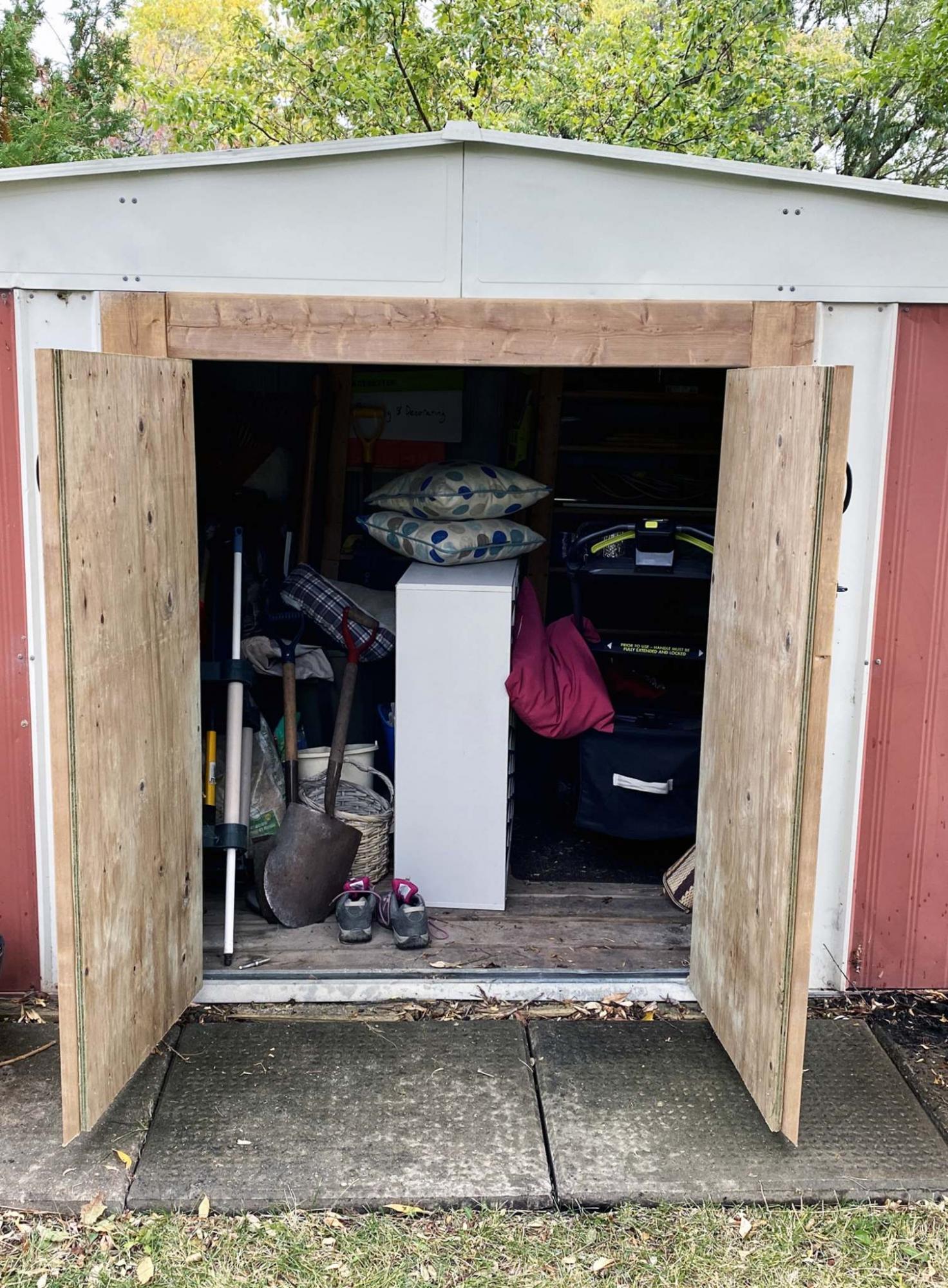 <p>The doors now open on front-facing hinges, mounted to a new wooden jamb.</p>