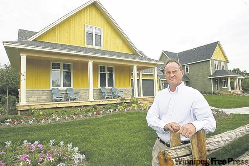 Chuck Laberge, shown, and architect Barry Hobin designed award-winning homes in Merrickville, Ont., that feature large front porches and panelling for a country flavour.
