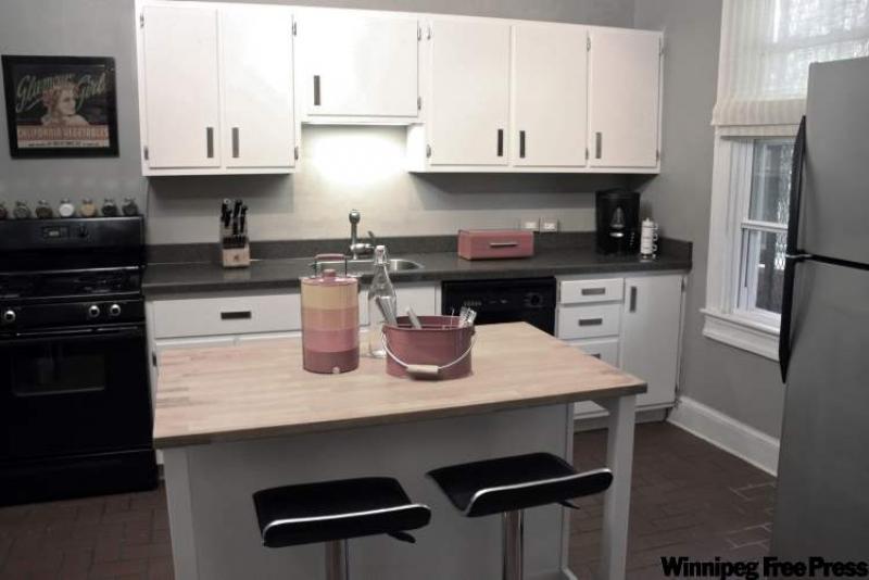 A kitchen makeover, featuring brown painted cabinets, by designer Sabrina Soto.