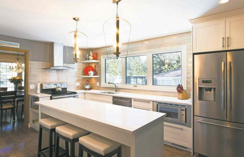 The kitchen following an extensive renovation. A new bank of windows lets in an abundance of natural light.