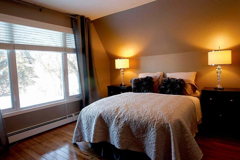 The master bedroom offers a gorgeous river view.