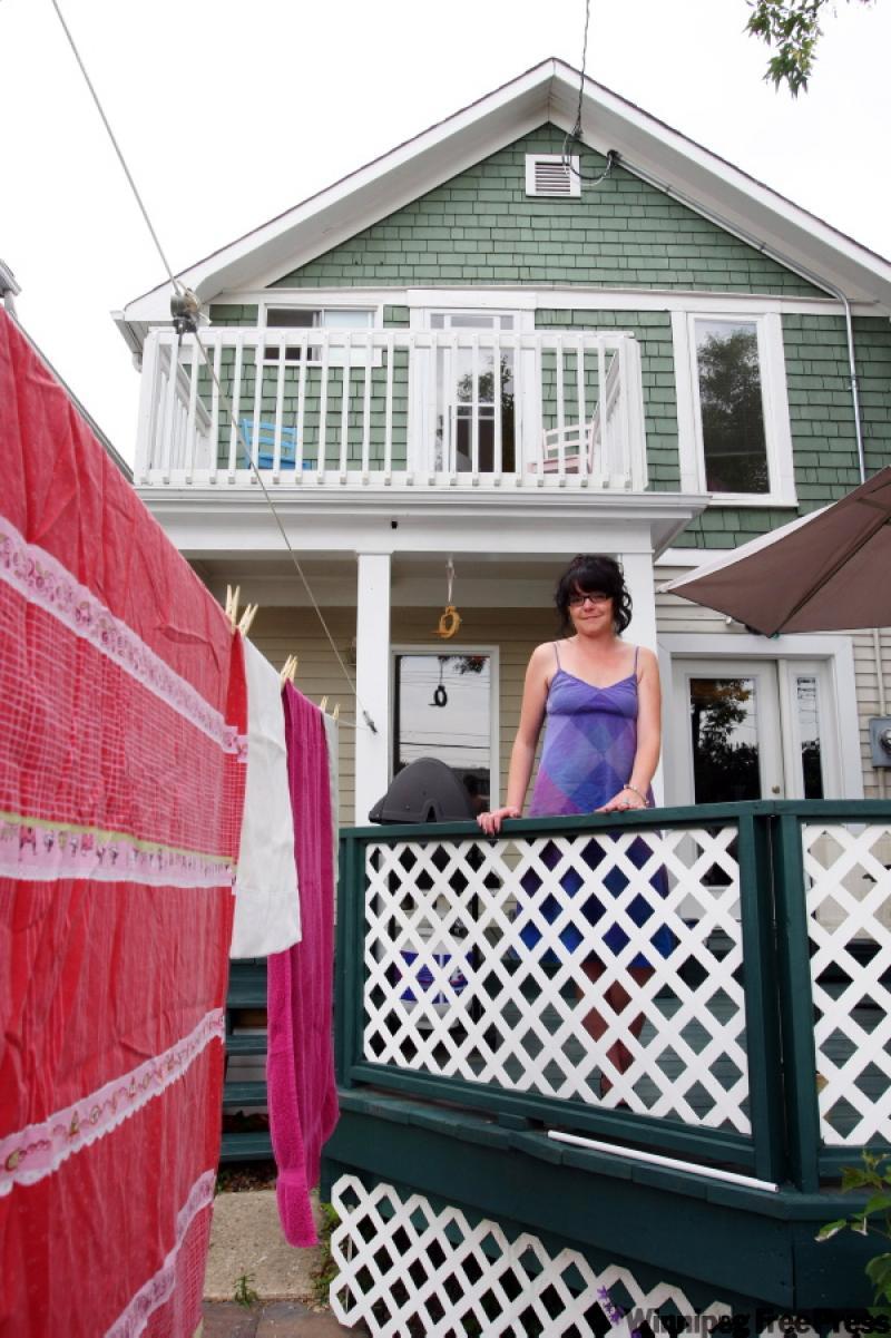 A clothesline in Corcoran's backyard reduces the load on her dryer. By the time she finishes all her home improvements, she hopes to be living in a fully environmentally friendly space. 
