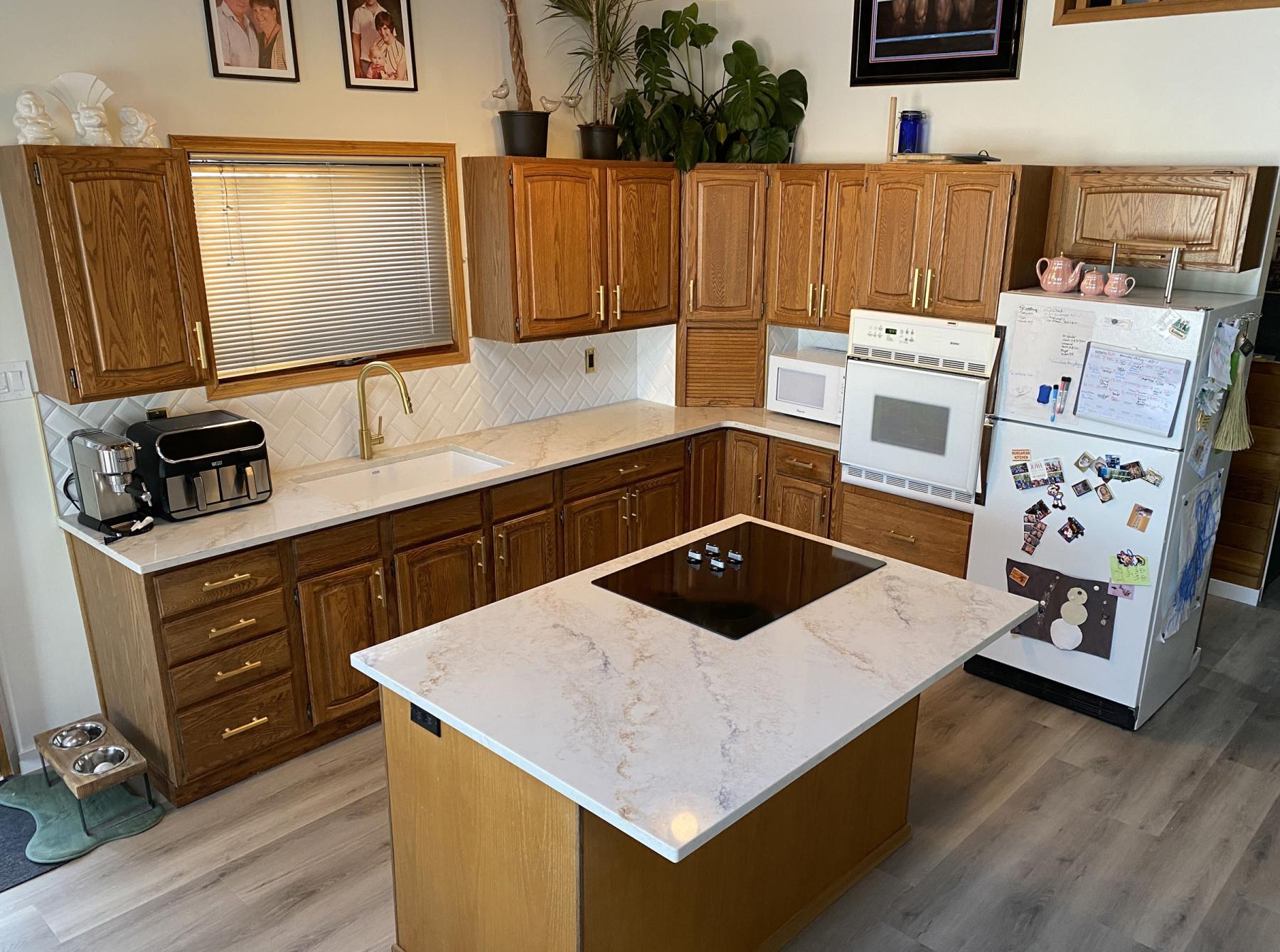  <p>PHOTOS BY Marc LaBossiere / Free Press</p>
                                <p>The entire kitchen received a much needed facelift, including new quartz countertops, sink, faucet and backsplash.</p> 