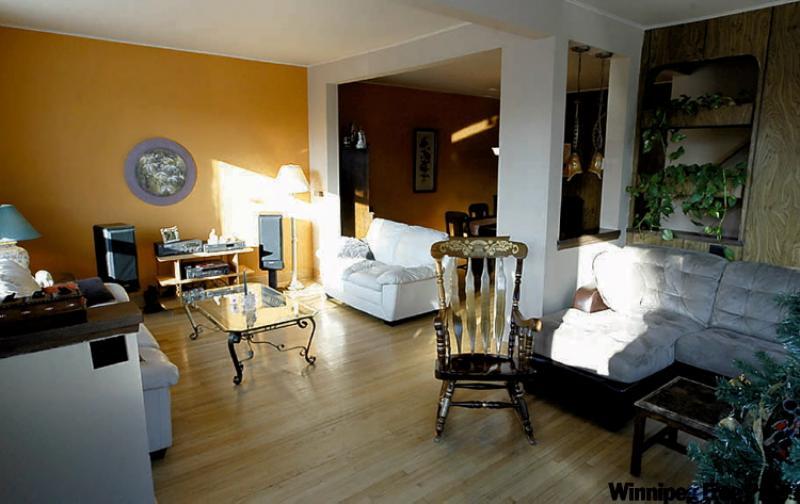 The owners knocked out a wall in the living room to expand the space. "It may have sacrificed a bedroom, but it made the living room.'