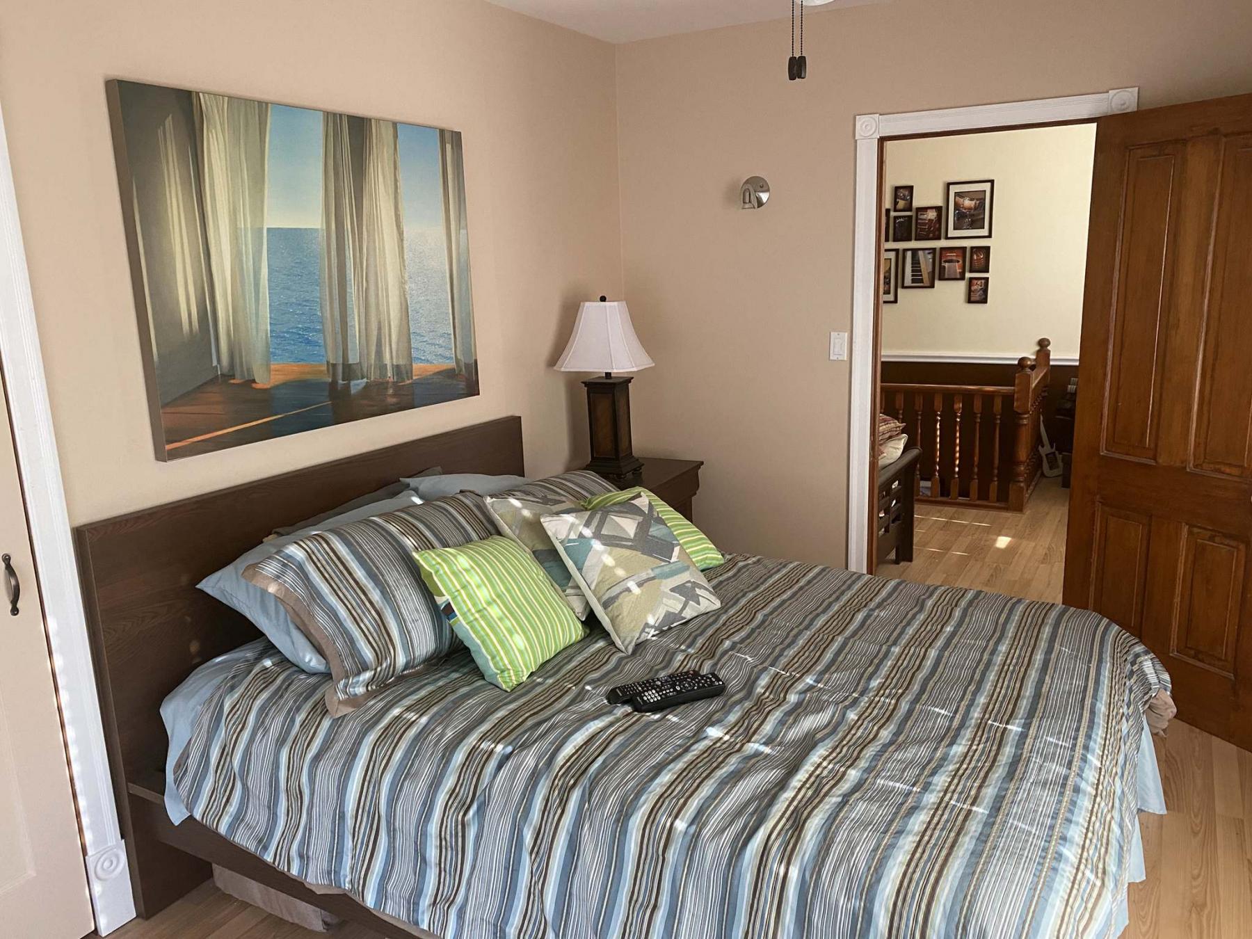 <p>Photos by Marc LaBossiere / Winnipeg Free Press</p><p>The walls were once again painted an earth-tone colour, and the bunk beds were exchanged for a queen-sized bed to match the new bedroom furniture. </p>