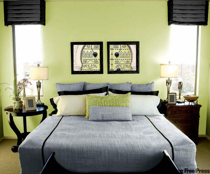 The use of charcoal grey and soft black accents in this bedroom really help the colours pop and keep the room from being too feminine.