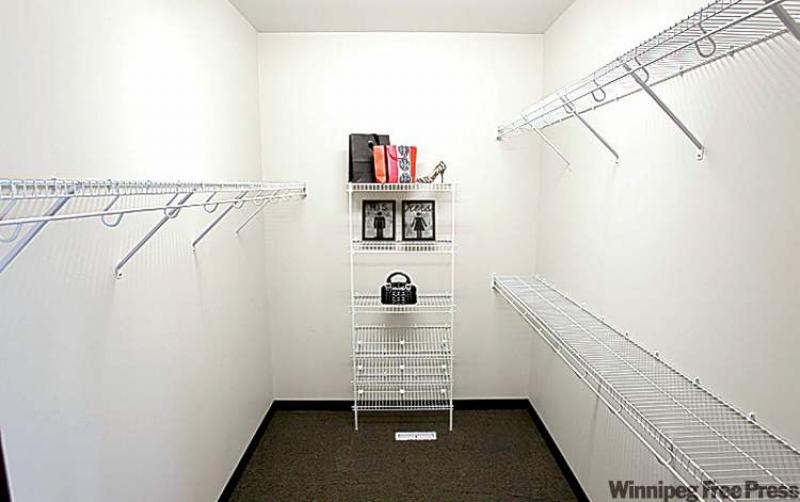 Huge walk-in closet in master suite.