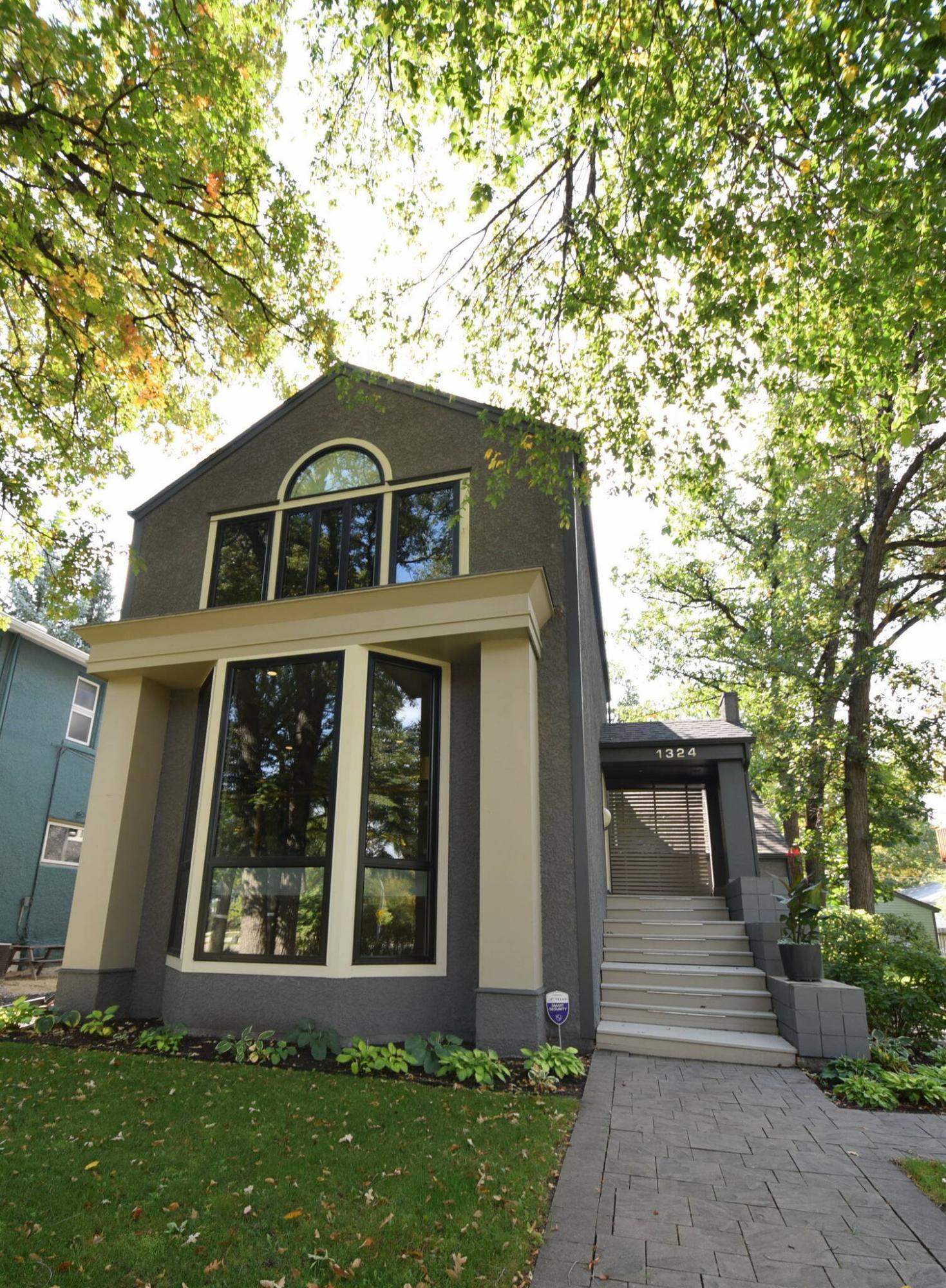  <p>The masterfully designed home, with its large windows framing views of the mature trees, is beautiful inside and out.</p> 