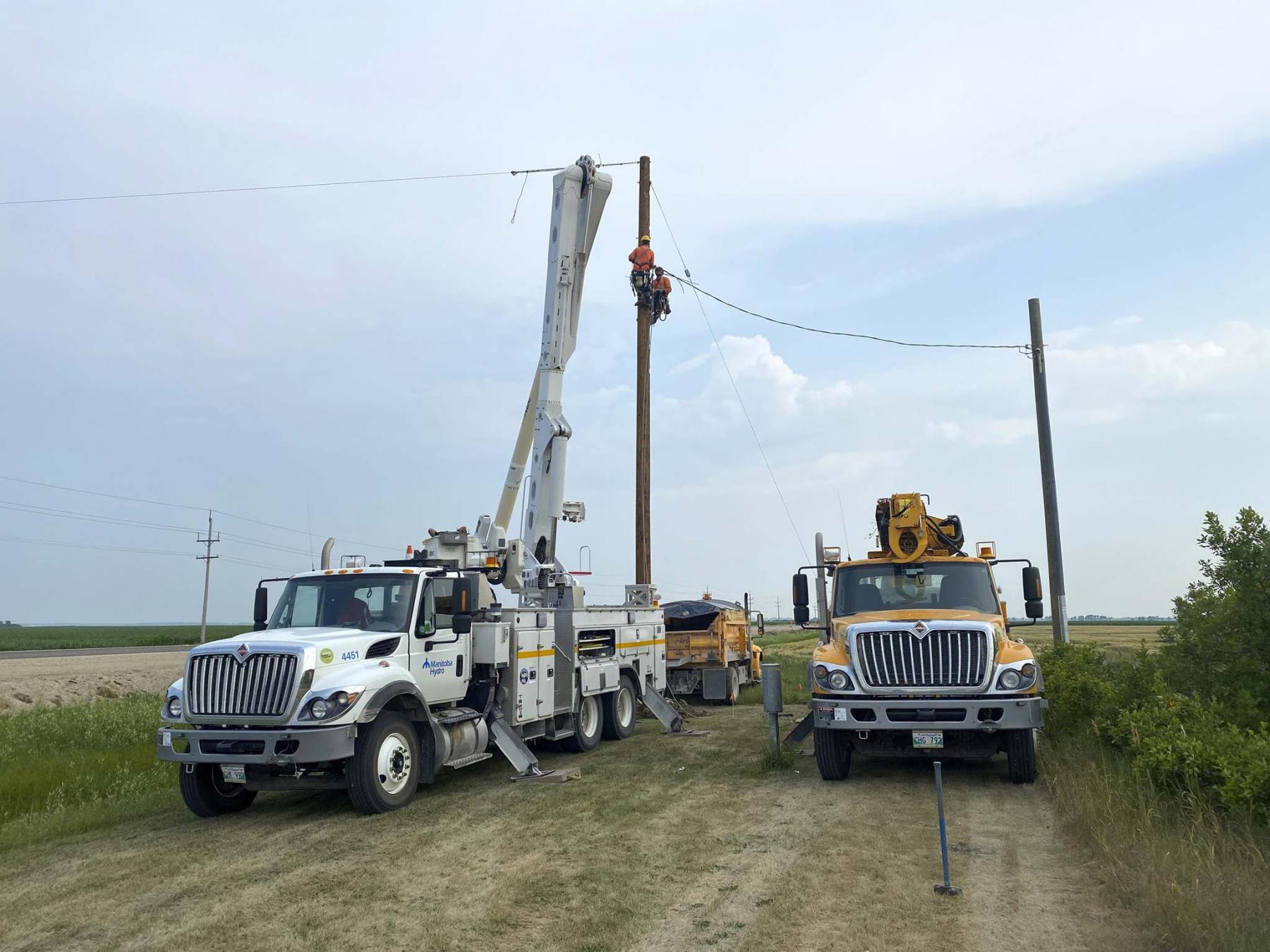 <p>Photos by Marc LaBossiere / Winnipeg Free Press</p><p>Hydro crews were quickly on the scene after an accident on the highway interrupted service to Marc&rsquo;s property, severing the line and snapping the pole (right). </p>