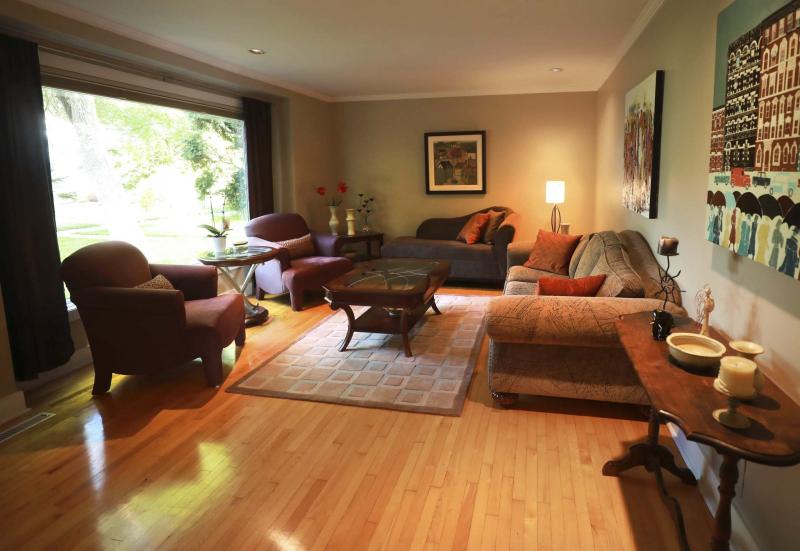 <p>RUTH BONNEVILLE / WINNIPEG FREE PRESS</p><p>The spacious living room of 18 Larchwood Place is cosy and full of natural light owing to a large picture window overlooking a wonderful view of mature tees.</p></p>