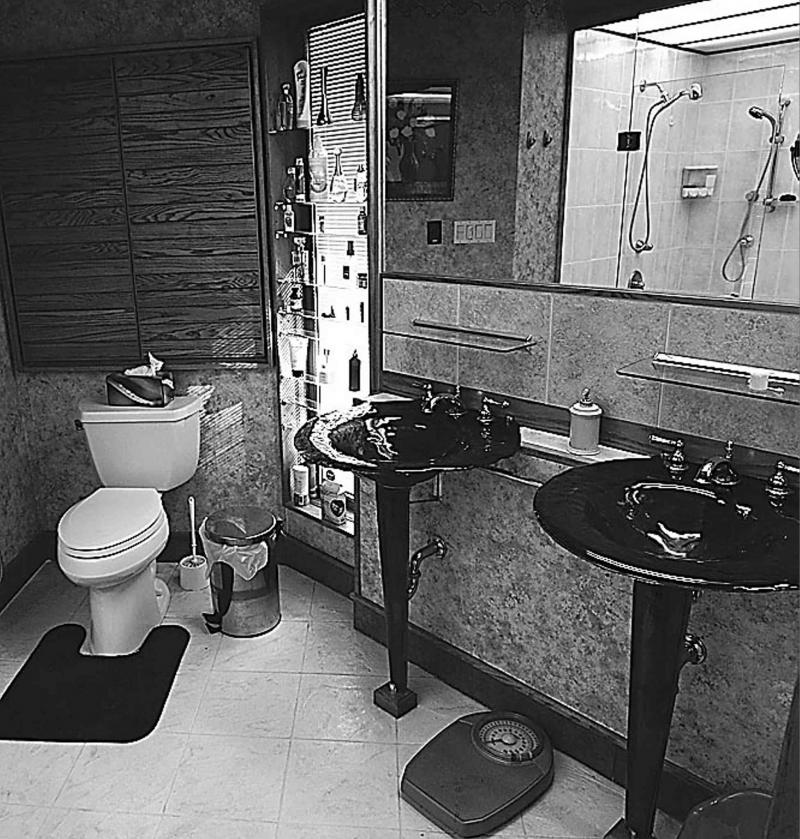 A Four-piece ensuite in the master bedroom features a jetted tub, tile/tempered-glass shower and tile floor, plus dual ceramic vanities.