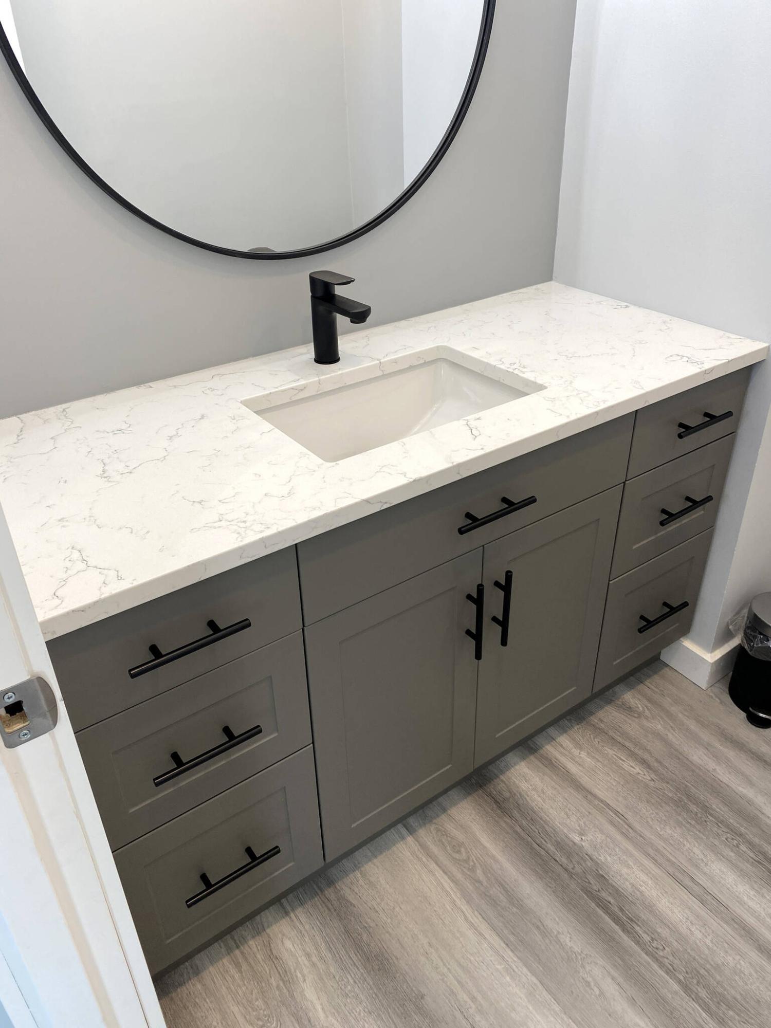  <p>Photos by Marc LaBossiere / Winnipeg Free Press</p>
                                <p>A custom vanity was ordered to fill the non-standard 52.5-inch cavity inset, topped with a quartz countertop and new sink.</p> 
