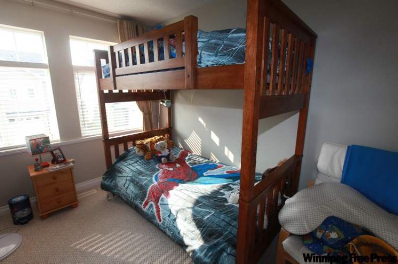 Spider Man-themed bedding helps complete the look of a newly redecorated room. Chances are good the cool-looking space will be kept neat and tidy. 