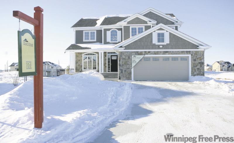 The home's traditional two-storey fa&ccedil;ade hides the 18-foot-tall great room inside, where columns of windows let in lots of light. The general theme of the windows is reflected in the style of c