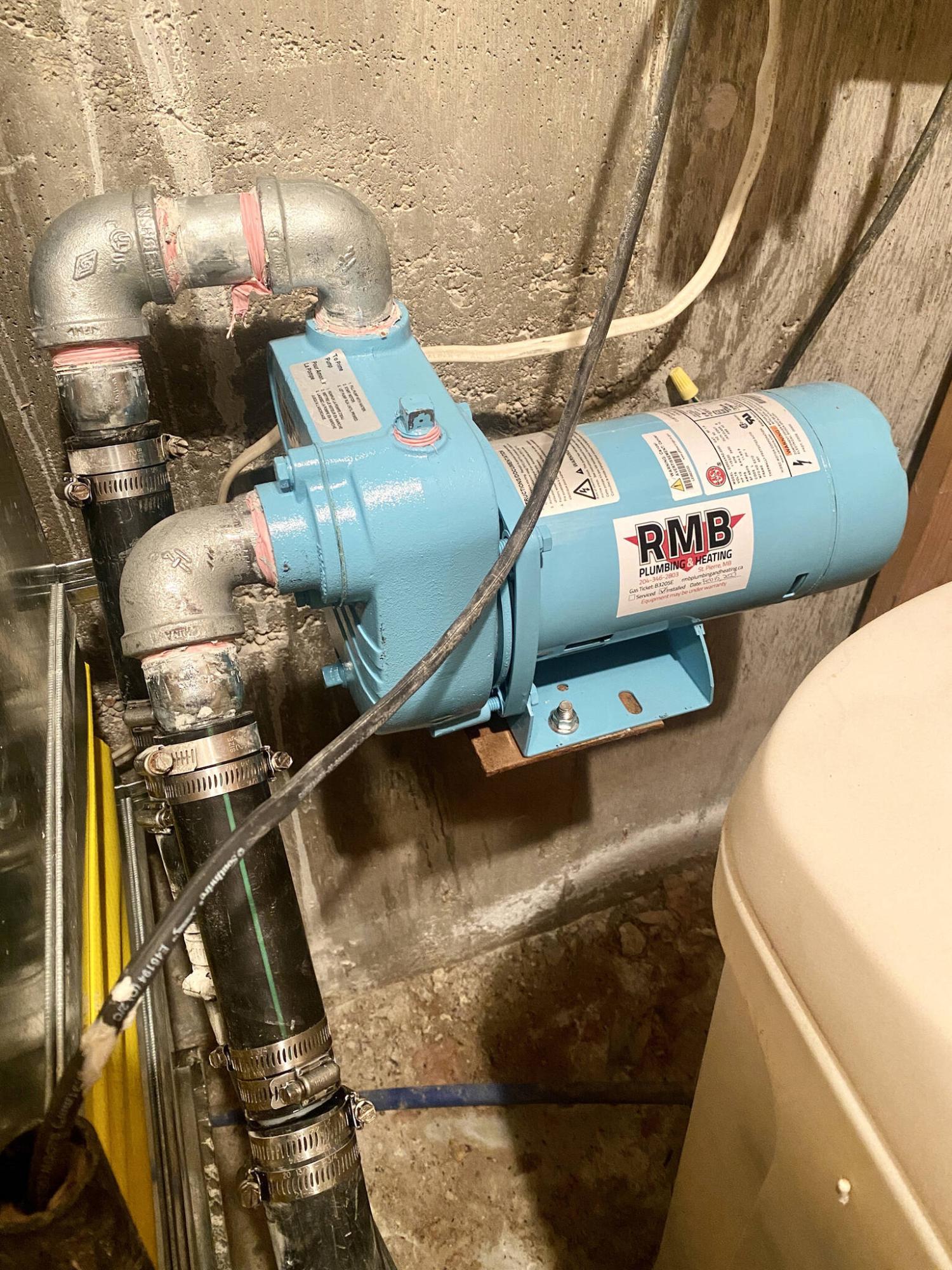  <p>Photos by Marc LaBossiere / Winnipeg Free Press</p>
                                <p>The new half&mdash;horsepower septic pump was mounted on the old bracket, attached to new fittings for the in and out-flow of the septic system.</p> 