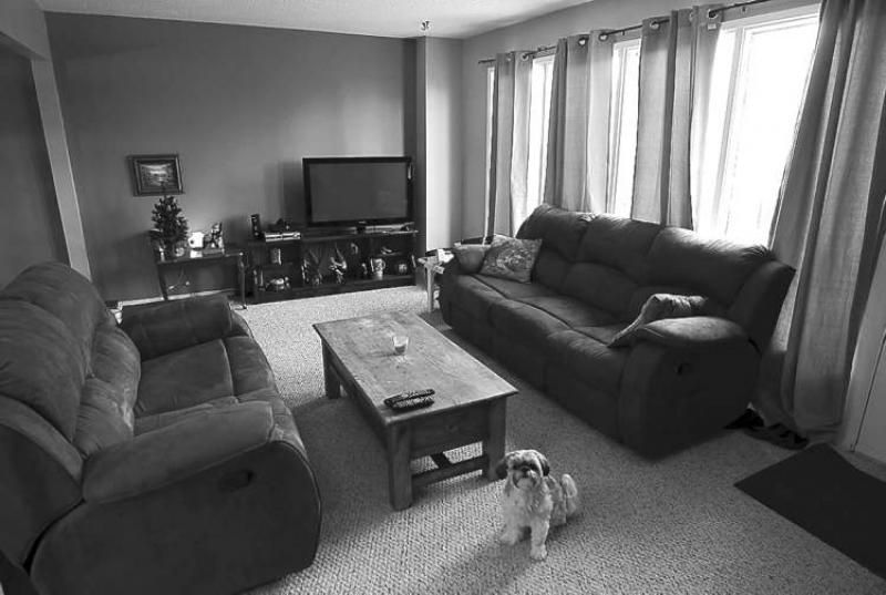 Not only is the living room generous in size, it also comes with a door that offers access to a backyard that backs on to green space. There�s ample room for a couch, love seat and TV.