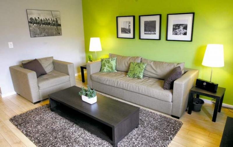 RIGHT: The living room is big enough to entertain and small enough to host an intimate evening.
BOTTOM RIGHT: The full basement is a rarity in condominiums; it has high ceilings and lots of natural light.
BOTTOM LEFT: The kitchen has a small island appropriate for dining or food preparation and is right next to the dining area.