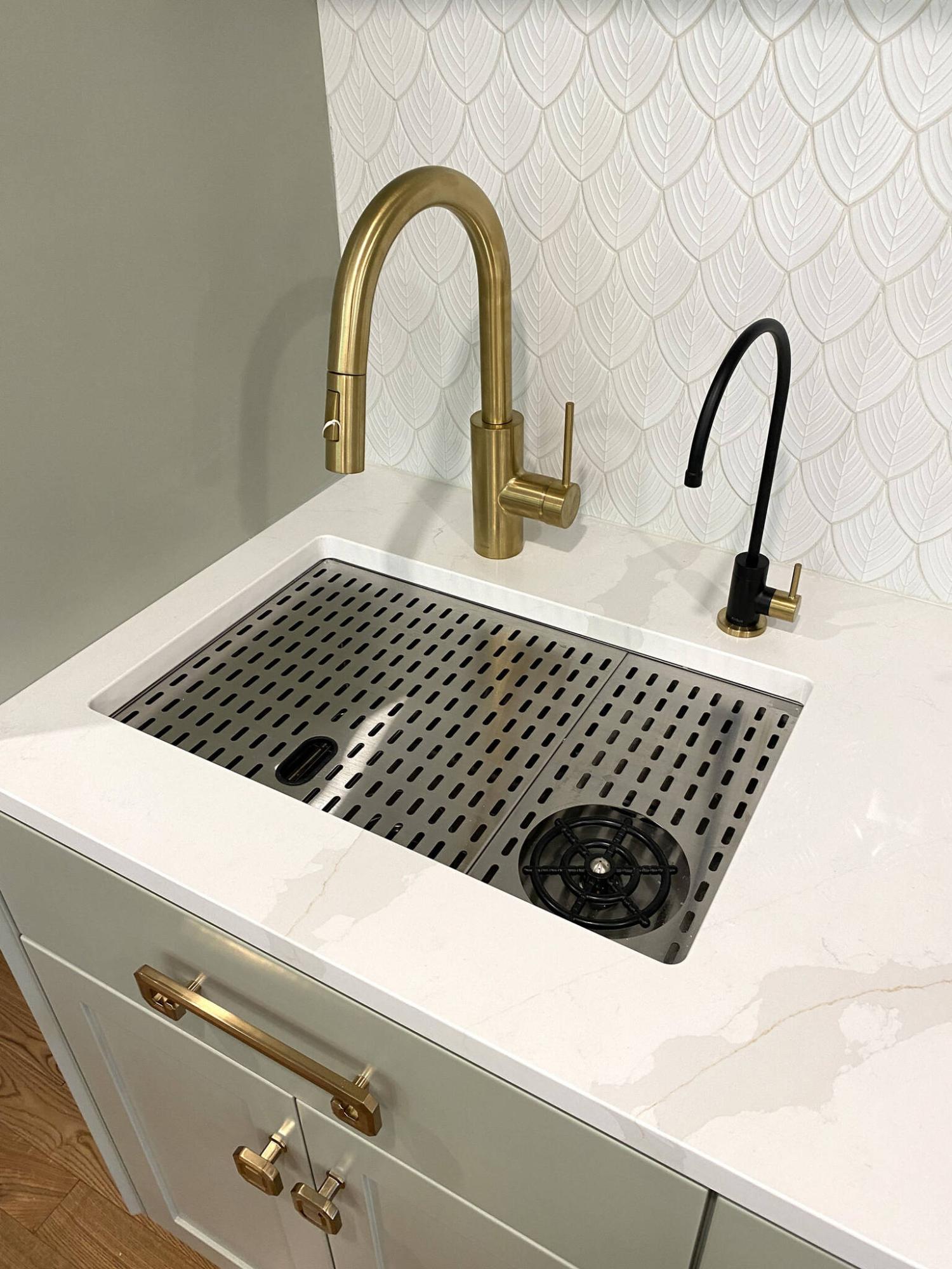  <p>MARC LABOSSIERE / FREE PRESS</p>
                                <p>The main faucet at the coffee bar is fed via the main hot and cold water feeds in the house, whereas the smaller faucet provides cold reverse-osmosis water only.</p> 