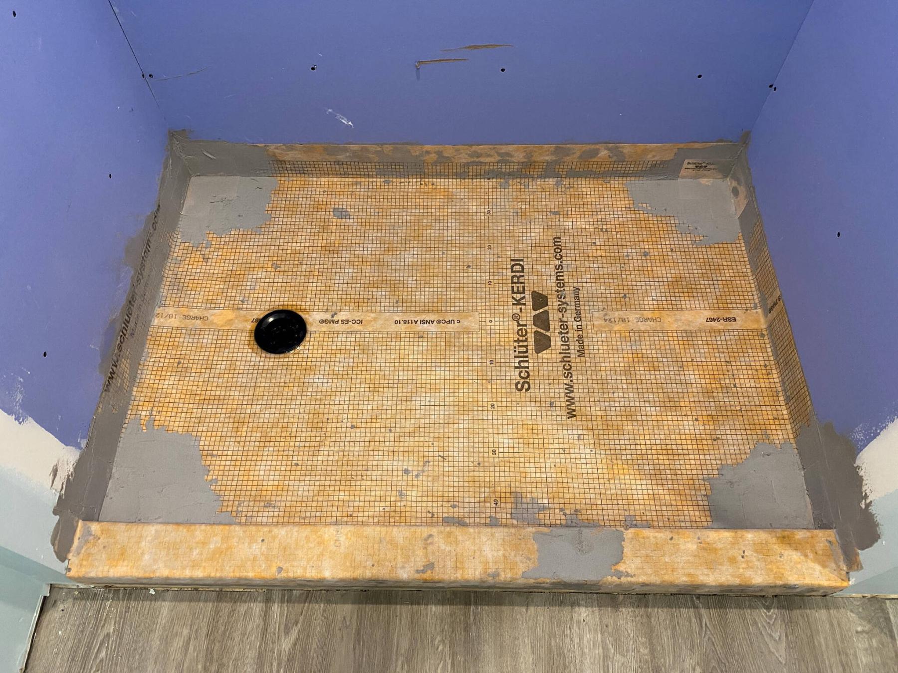 <p>MARC LABOSSIERE / FREE PRESS</p>
                                <p>The shower base (above) is fitted with waterproof cloth and glued to the sloped plywood base below. Pie-shaped plywood pieces (right) introduce a slope toward the drain.</p> 