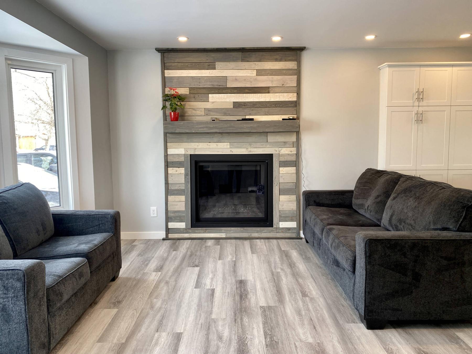  <p>Marc LaBossiere / Winnipeg Free Press</p>
                                <p>The homeowners&rsquo; fireplace had been upgraded using grey wood tones, and the walls and flooring were chosen to blend in.</p> 